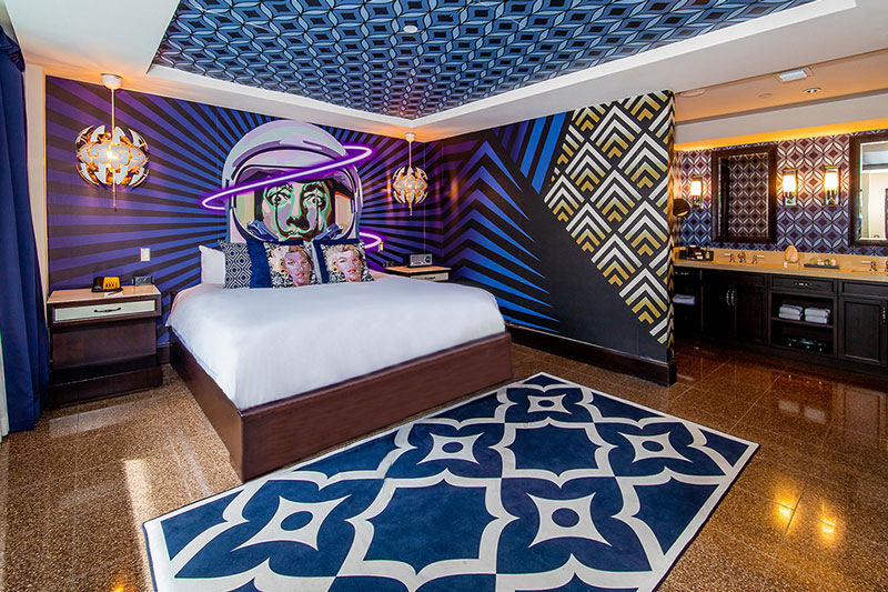 a room with a bed and a rug