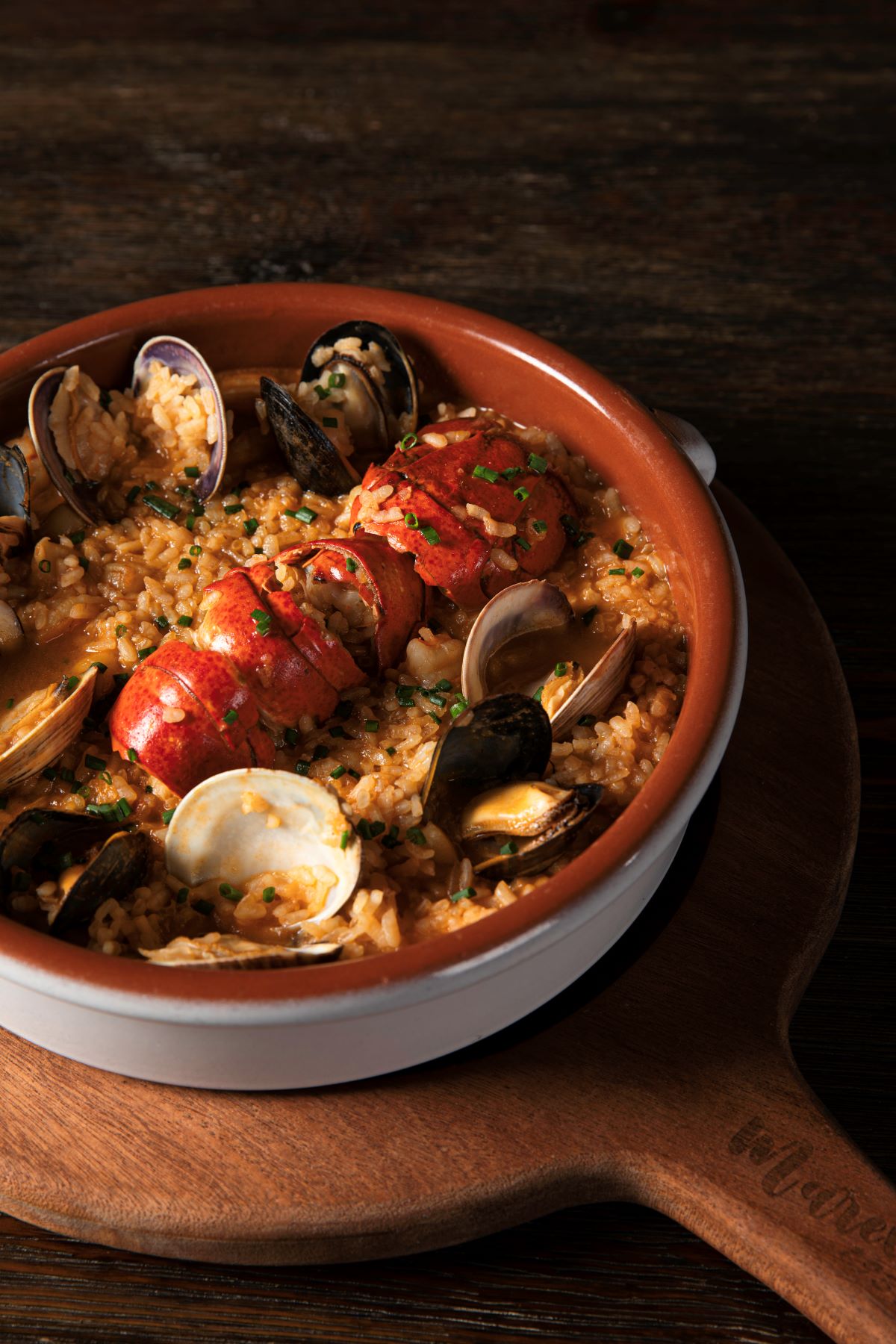 a bowl of seafood rice and mussels