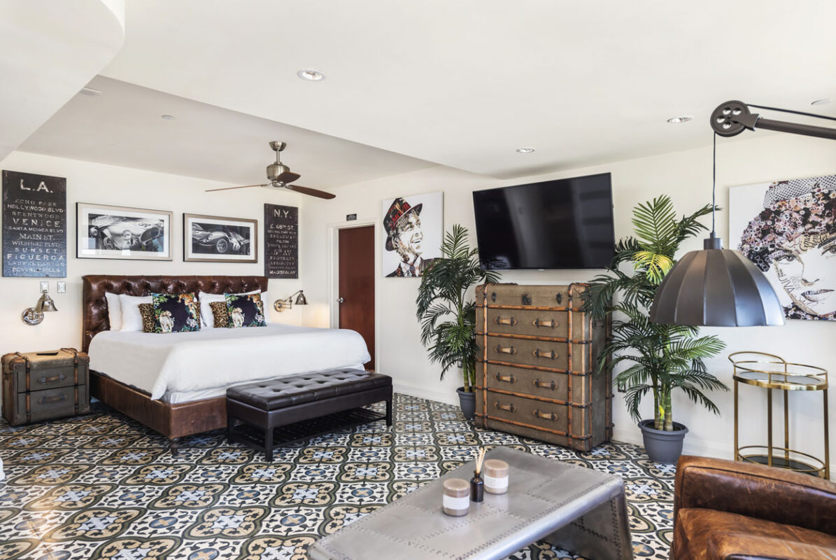 a bedroom with a tv and a dresser