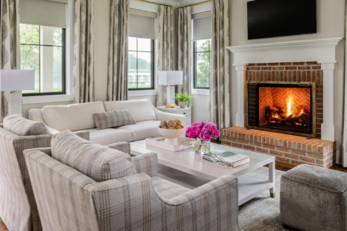 a living room with a fireplace and couches