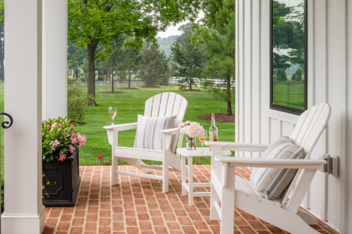a white chairs on a brick porch