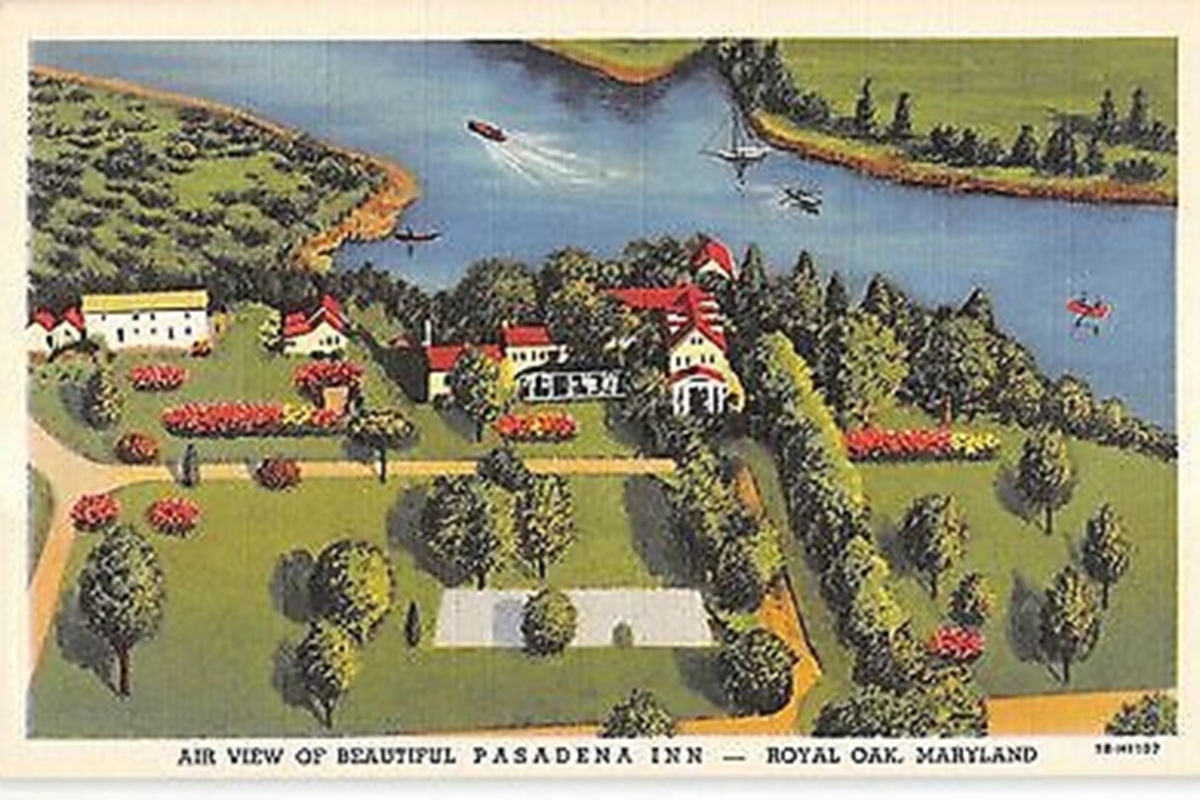 a painting of a town by a river