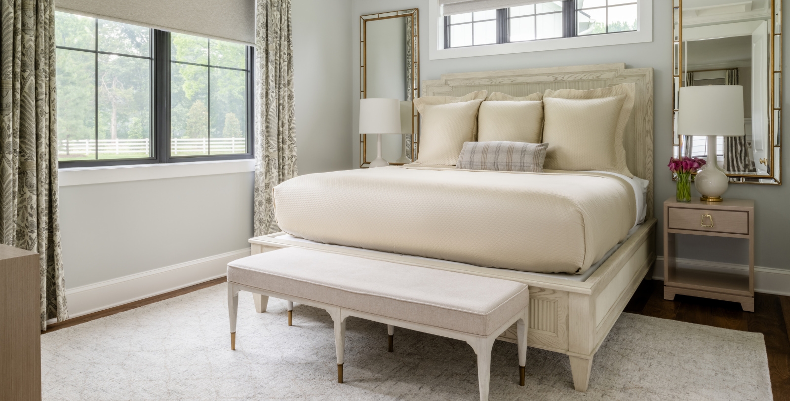 a bed with a bench in a room