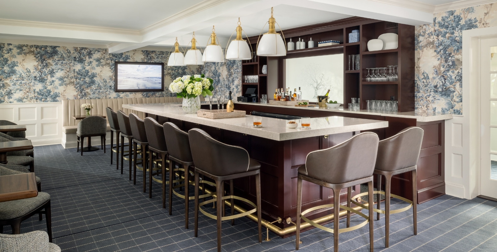 a bar with chairs and a counter