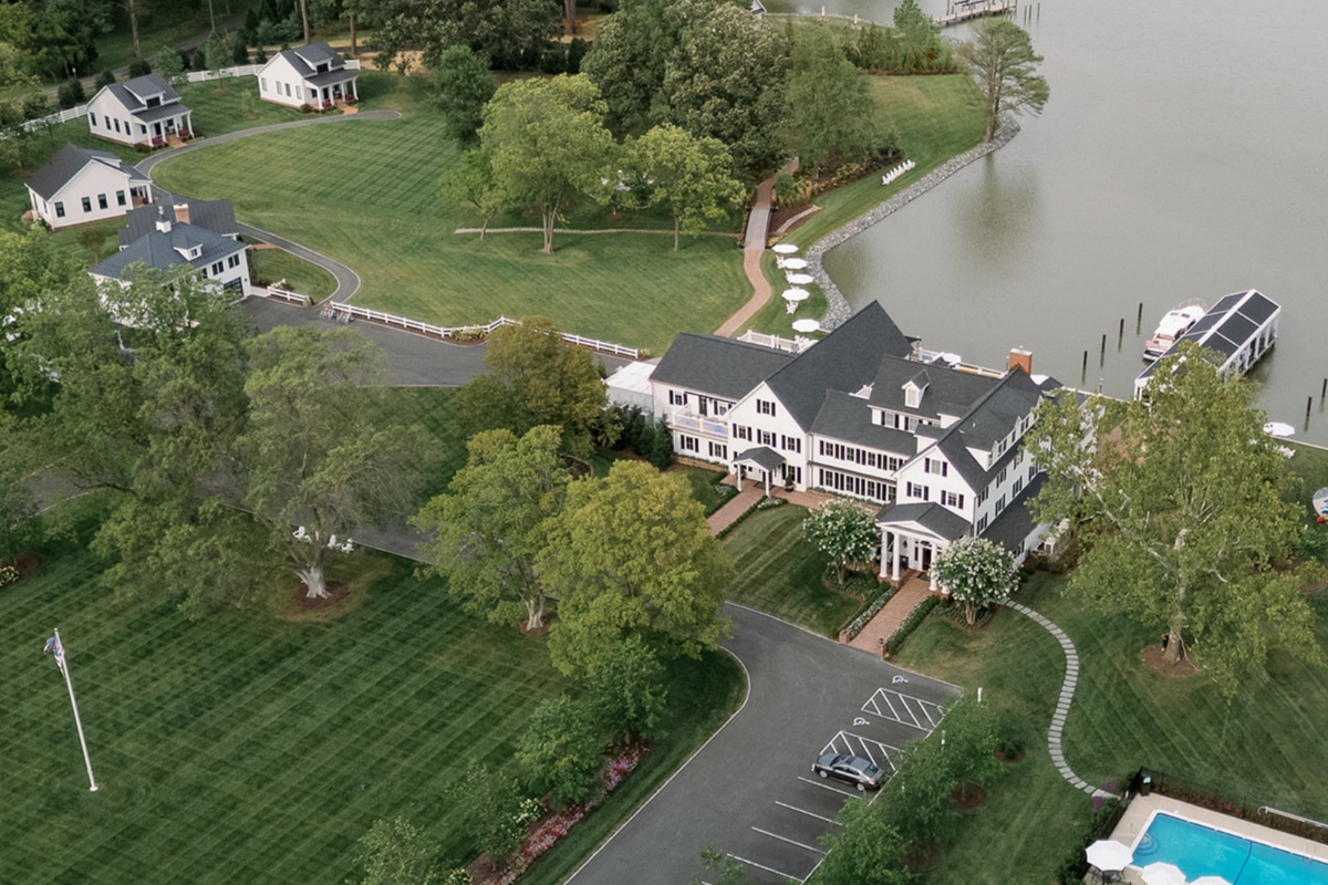 a large house next to a body of water
