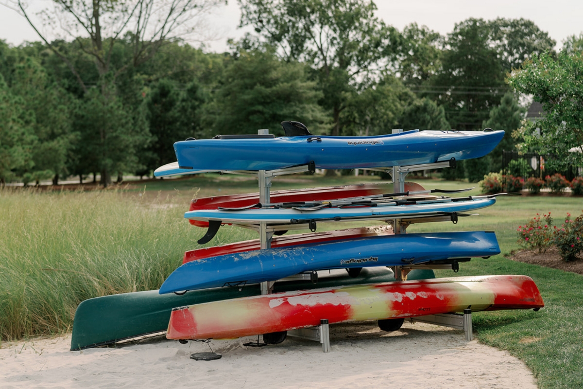 a rack of kayaks on a beach