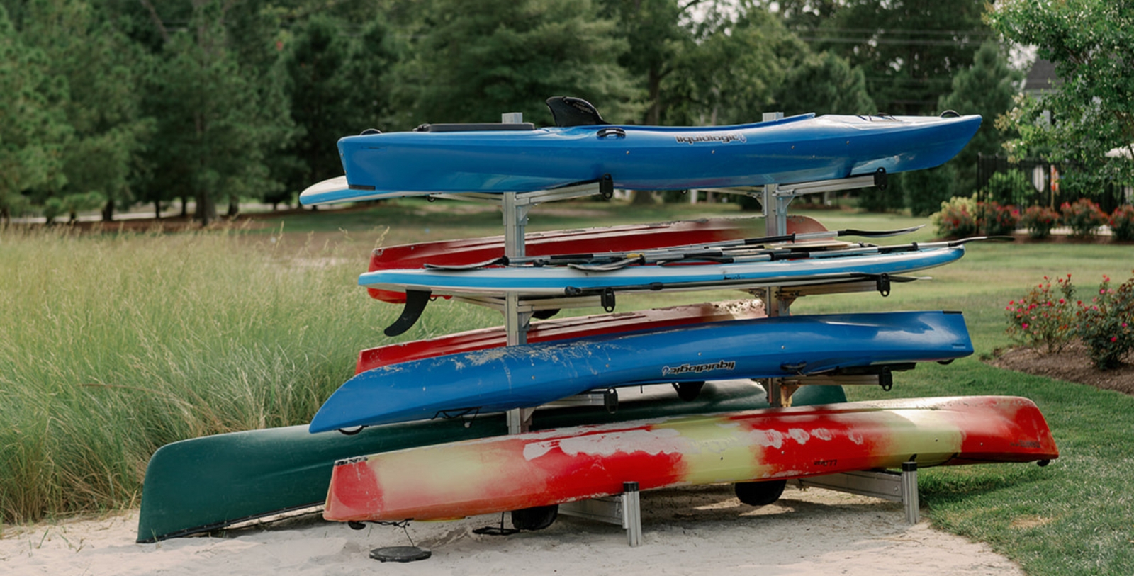 a rack of kayaks on a beach