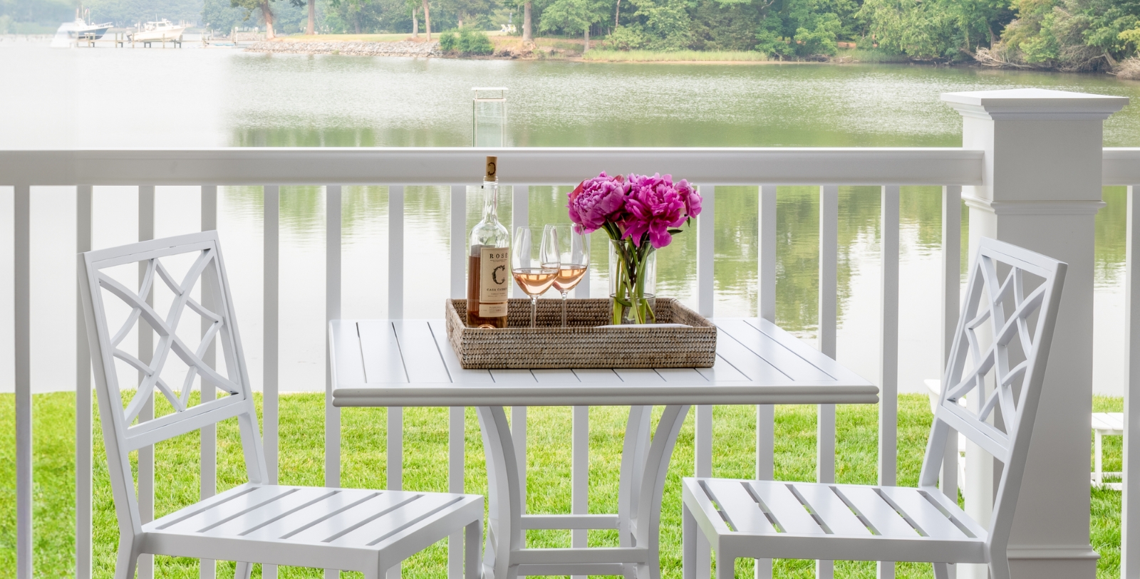 a table with wine glasses and flowers on it