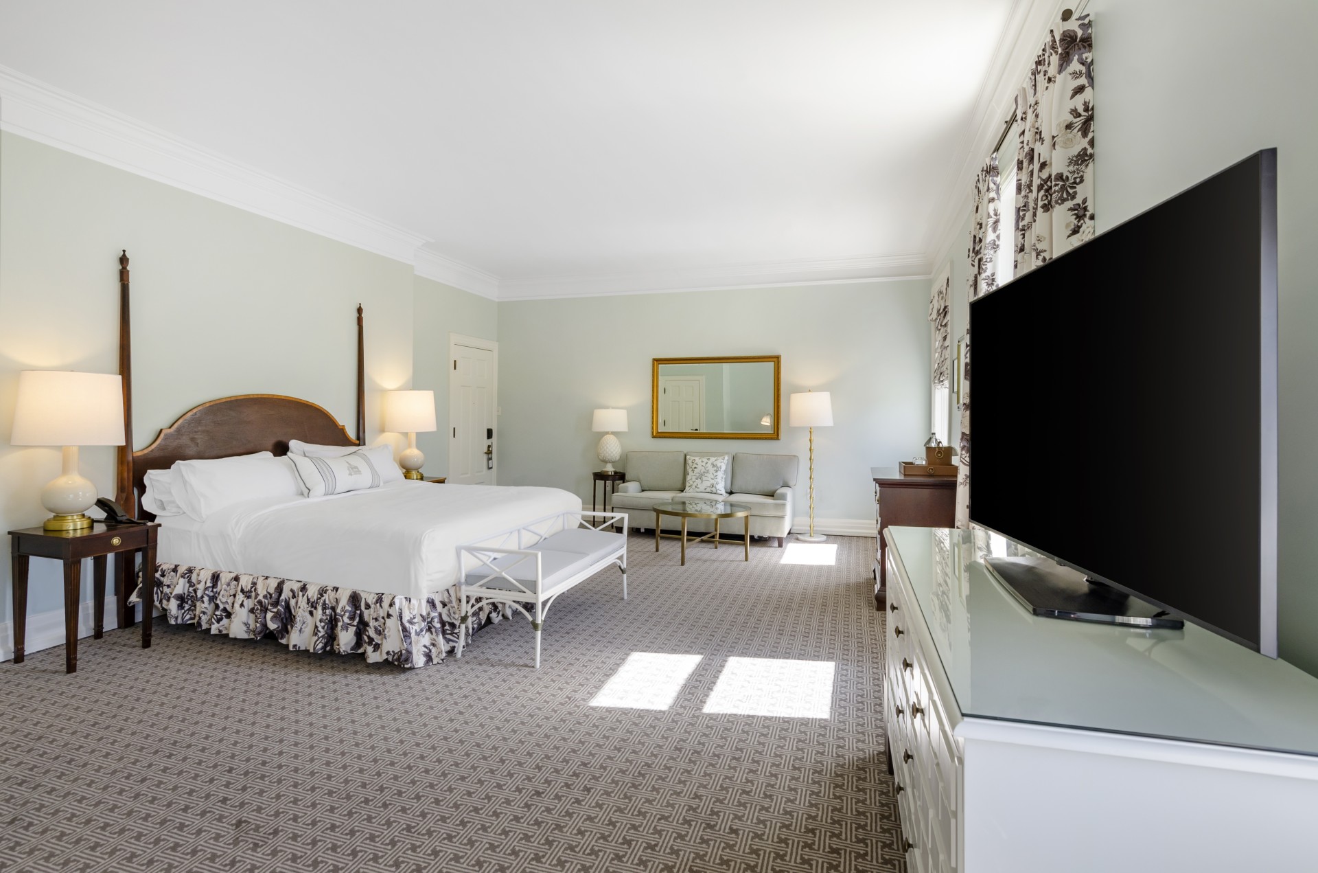 a bedroom with a television and a bed