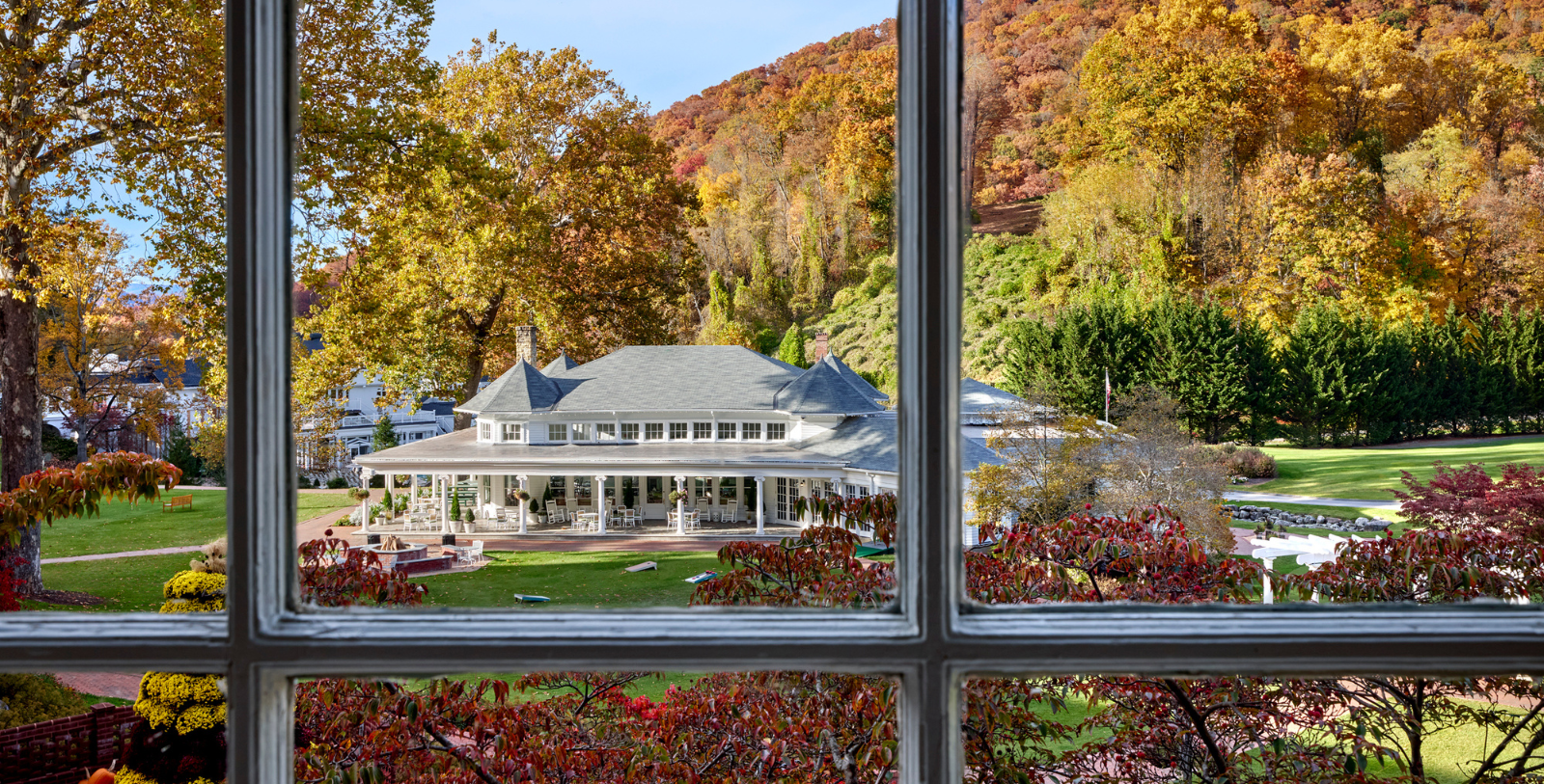 a view of a large white house from a window