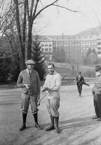 a group of men standing on a road