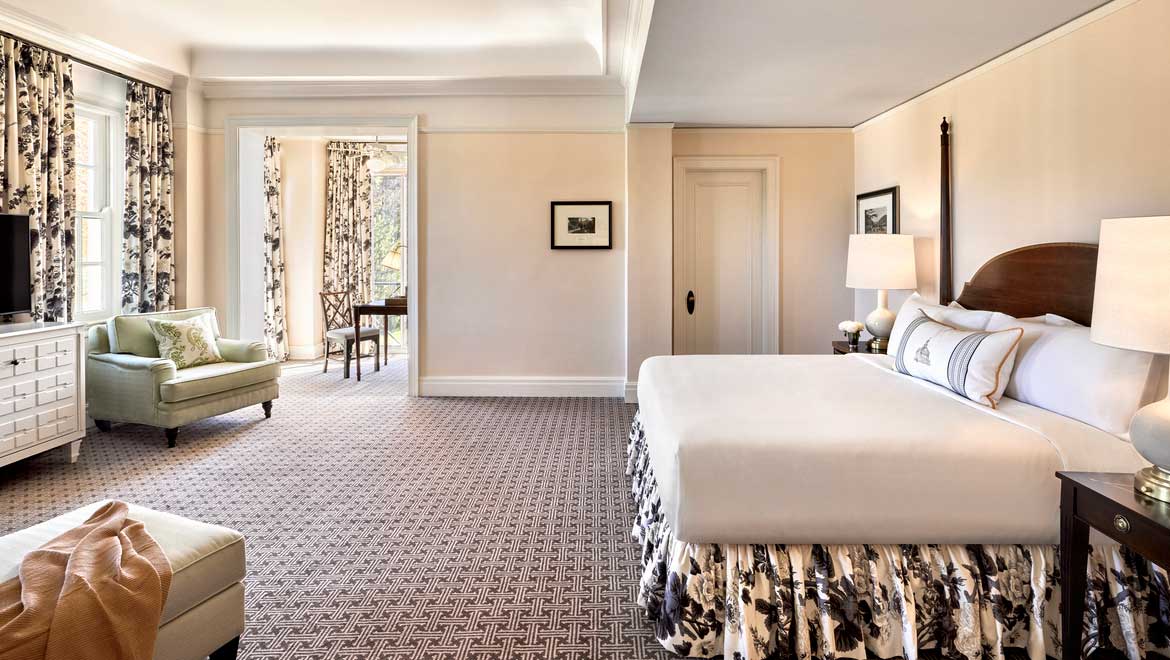 a bedroom with a bed and a chair