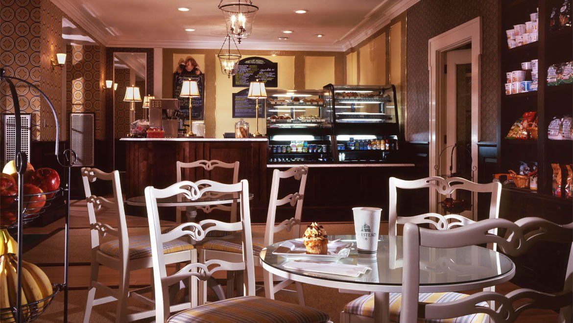 a coffee shop with a cupcake and a cake