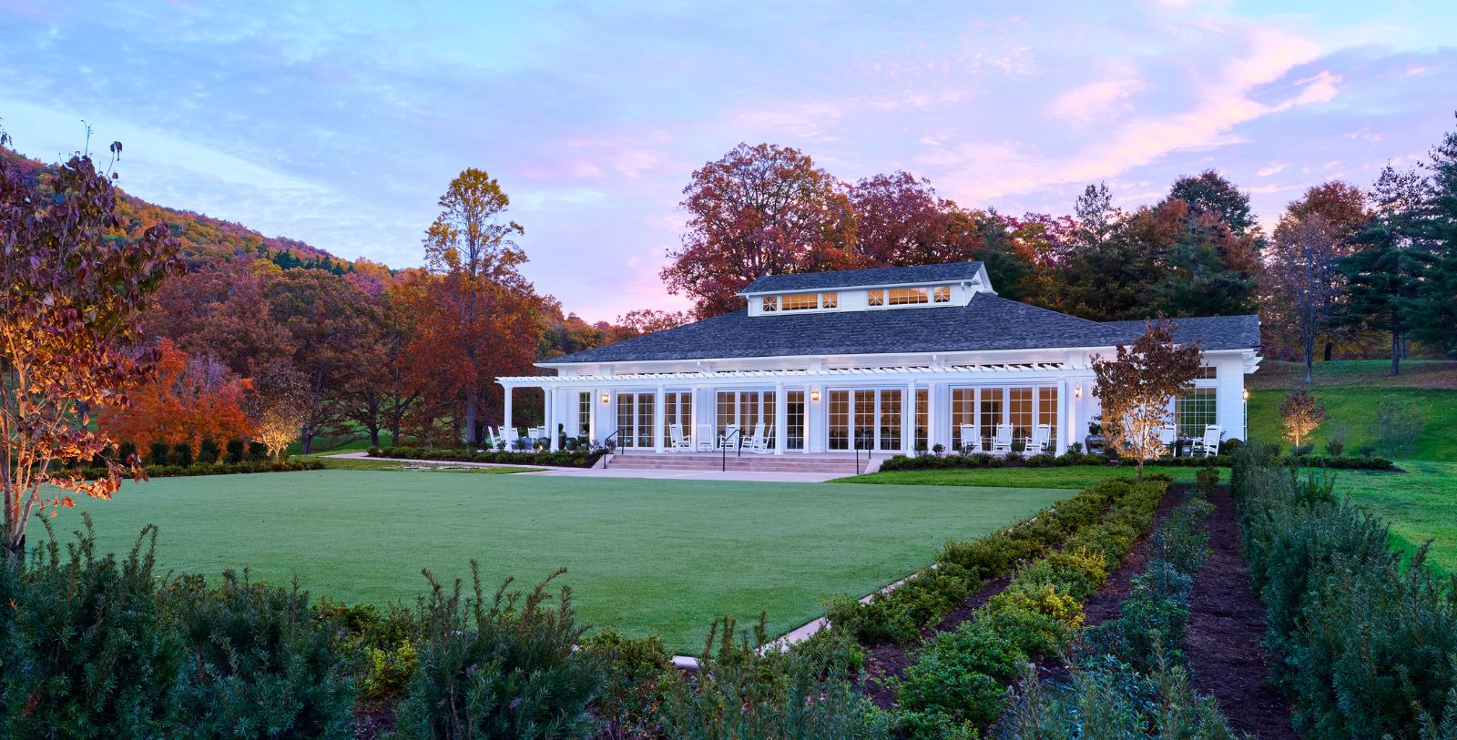 a building with a lawn and trees