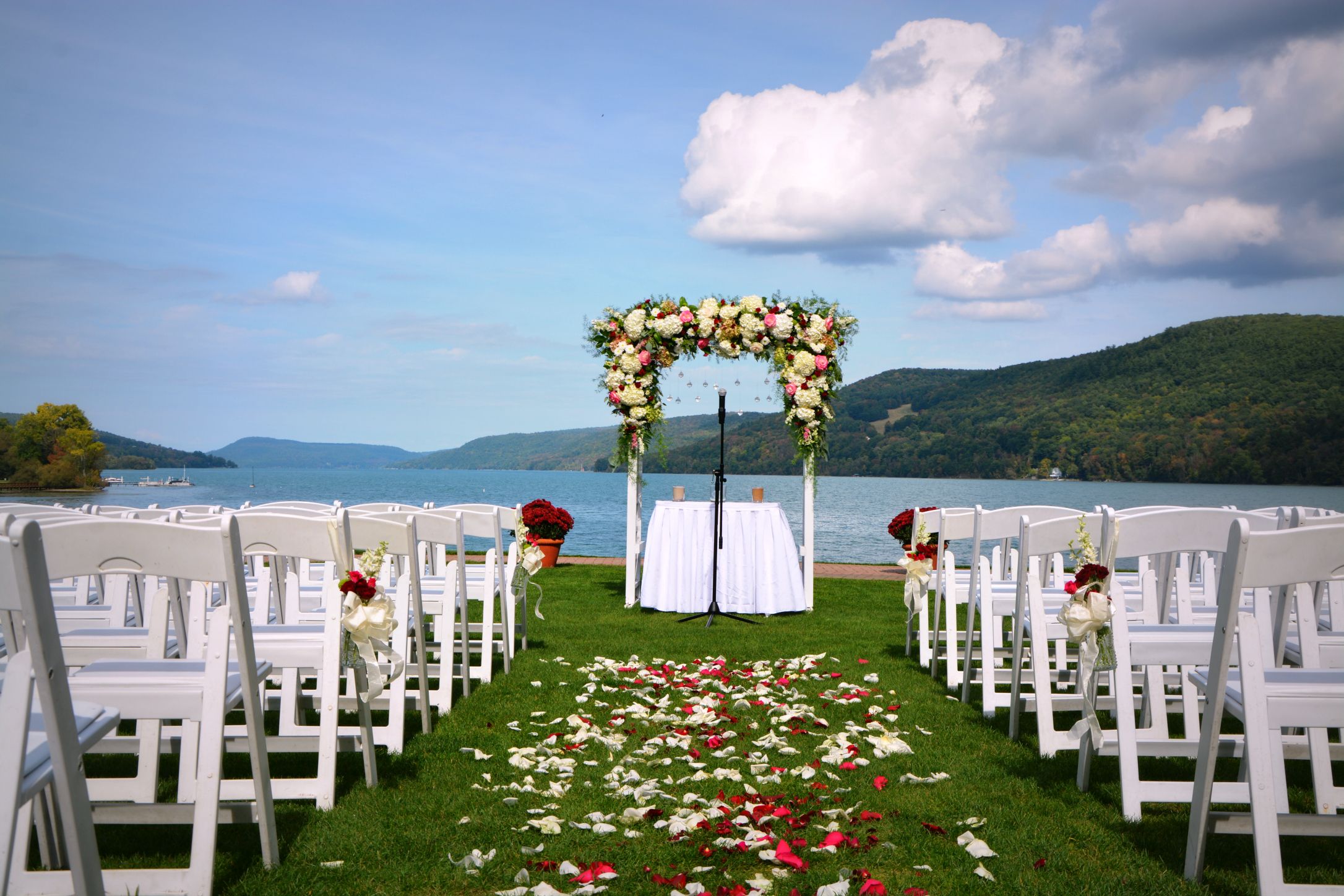 a wedding set up with chairs and flowers