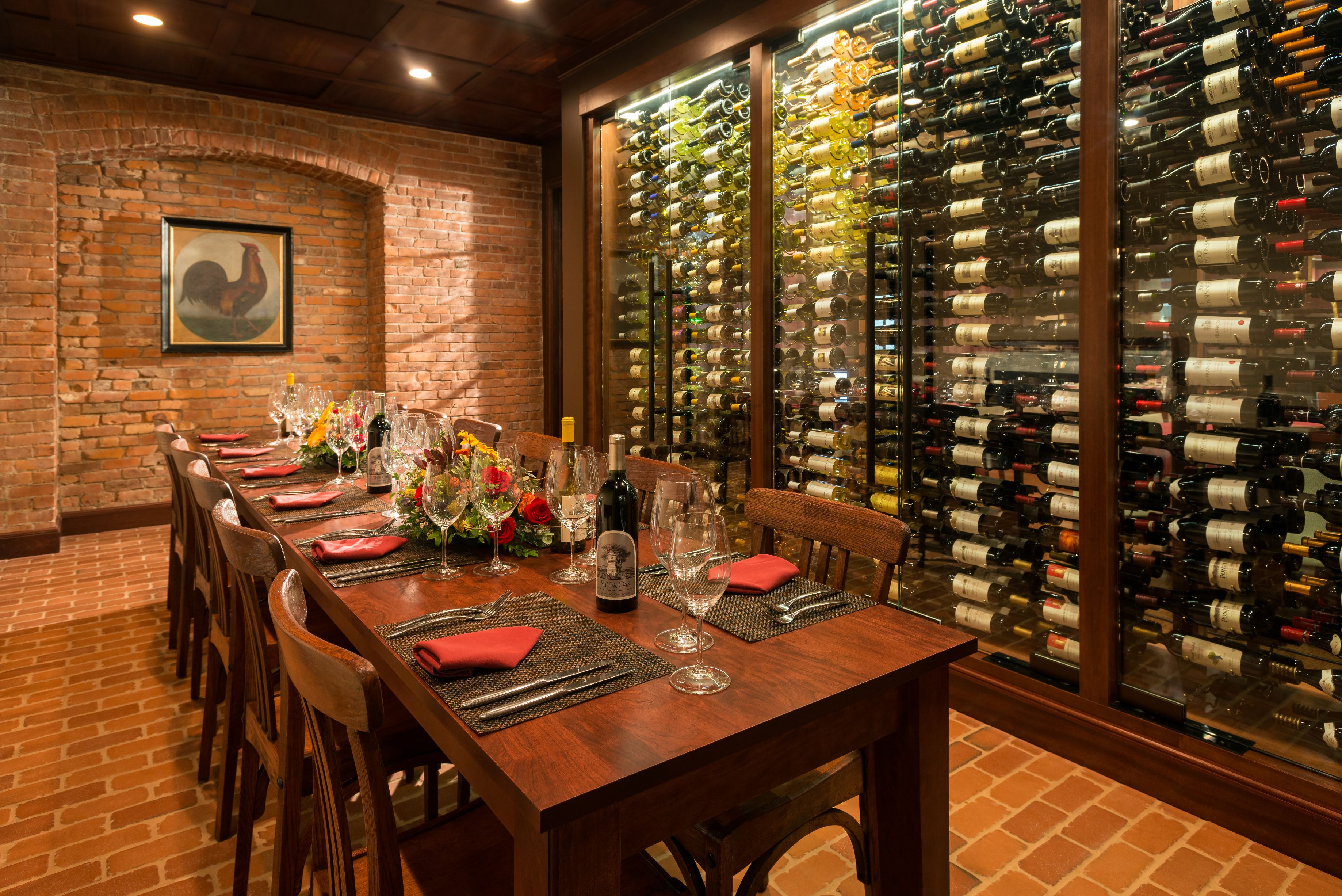 a table with wine bottles and glasses