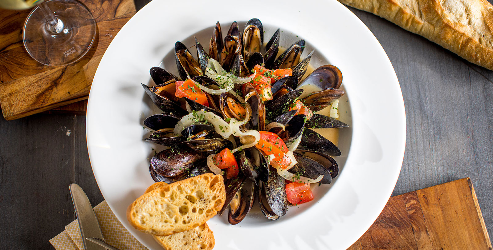 a plate of mussels and toast