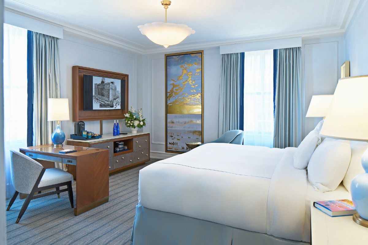 a room with a bed and a desk