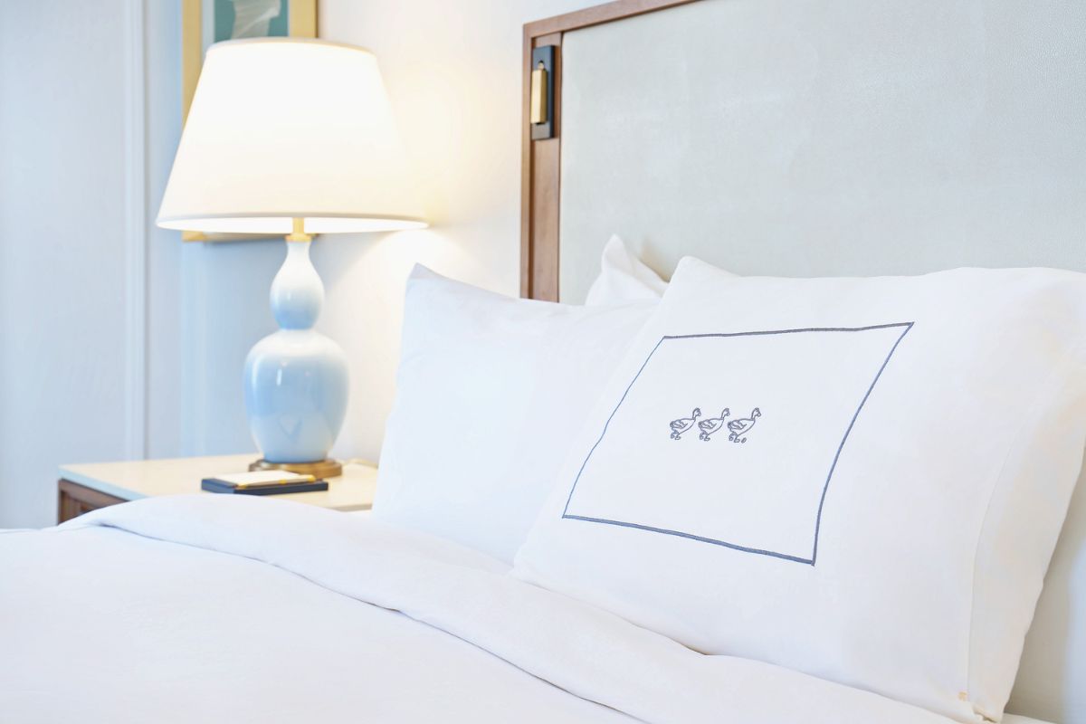 a white pillow on a bed