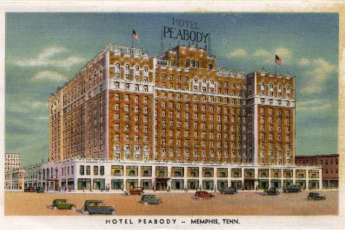 a large building with flags on it