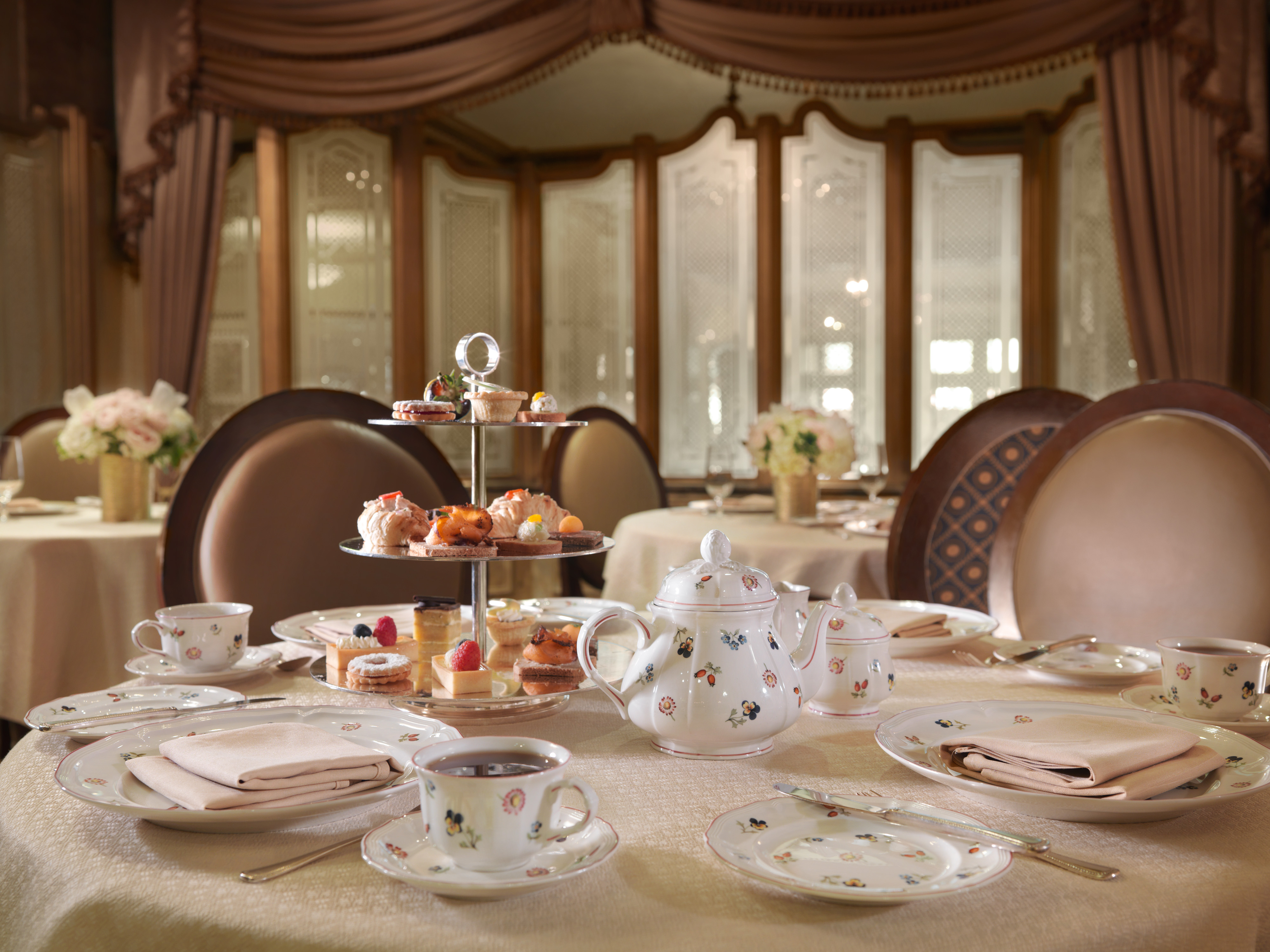 a tea set with teapots and cups on a table