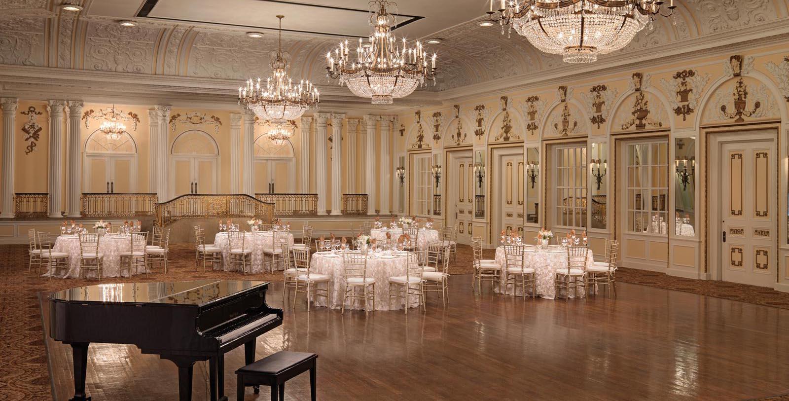 a ballroom with tables and chairs