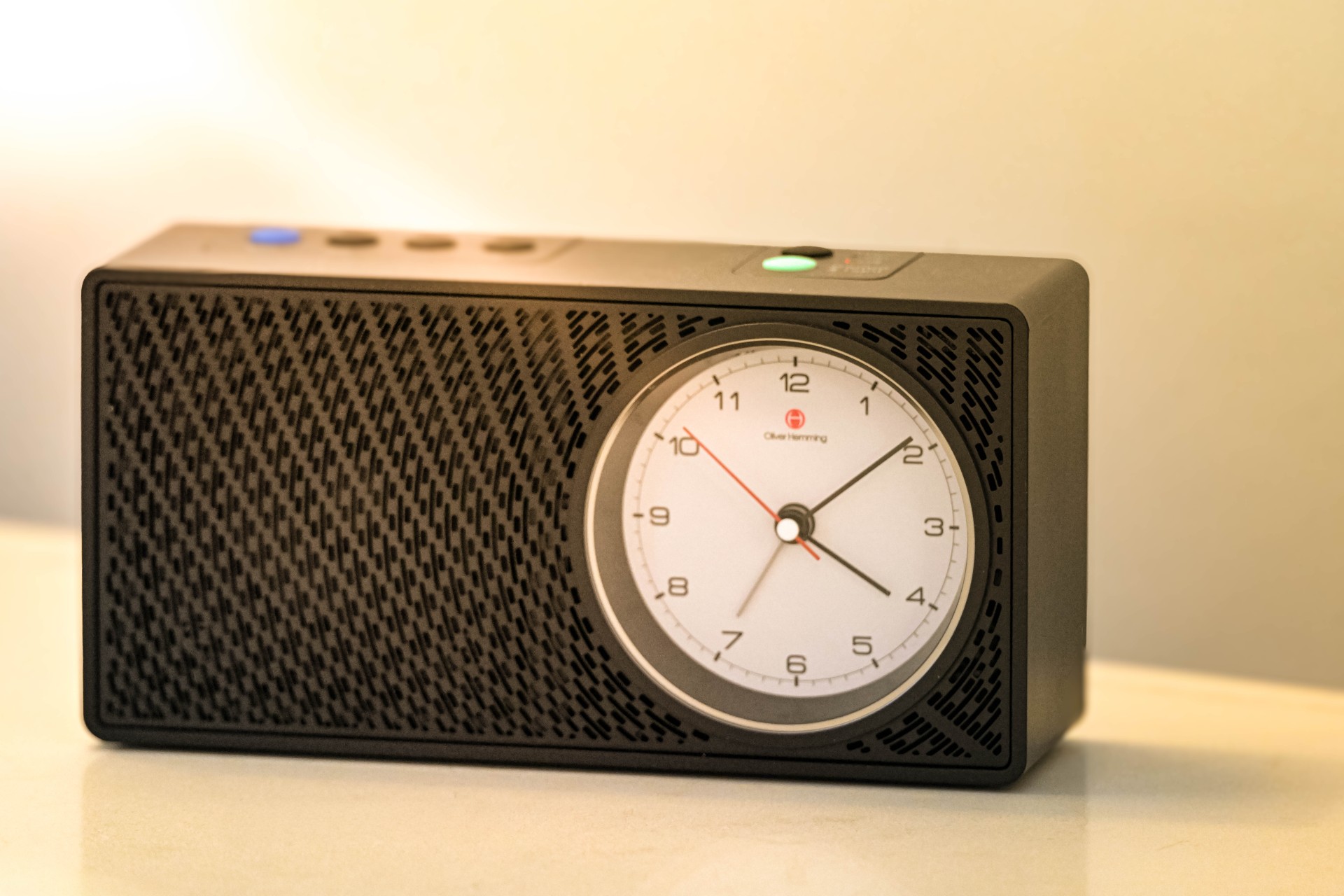 a black rectangular clock with a white face