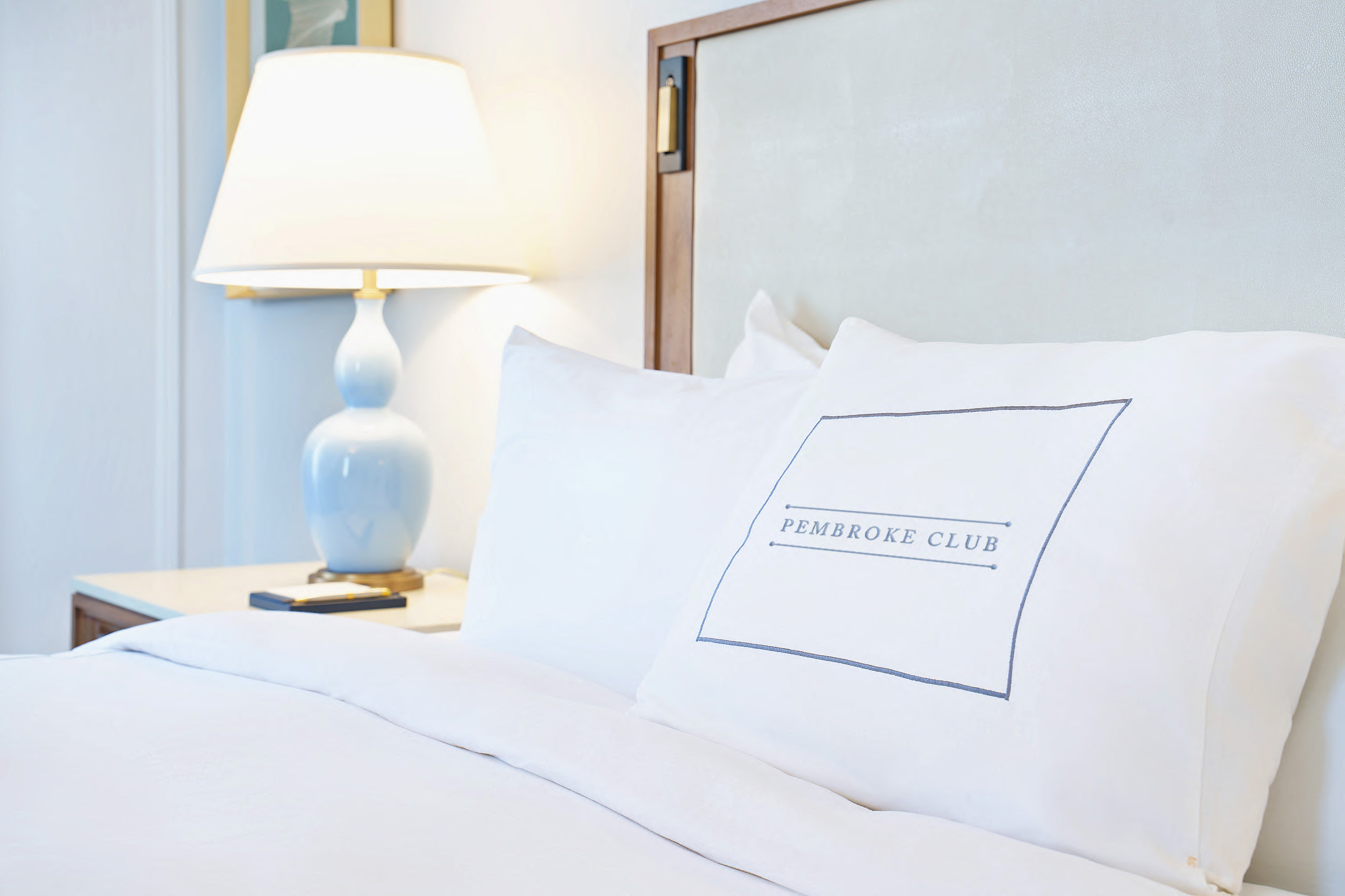 a white pillow on a bed