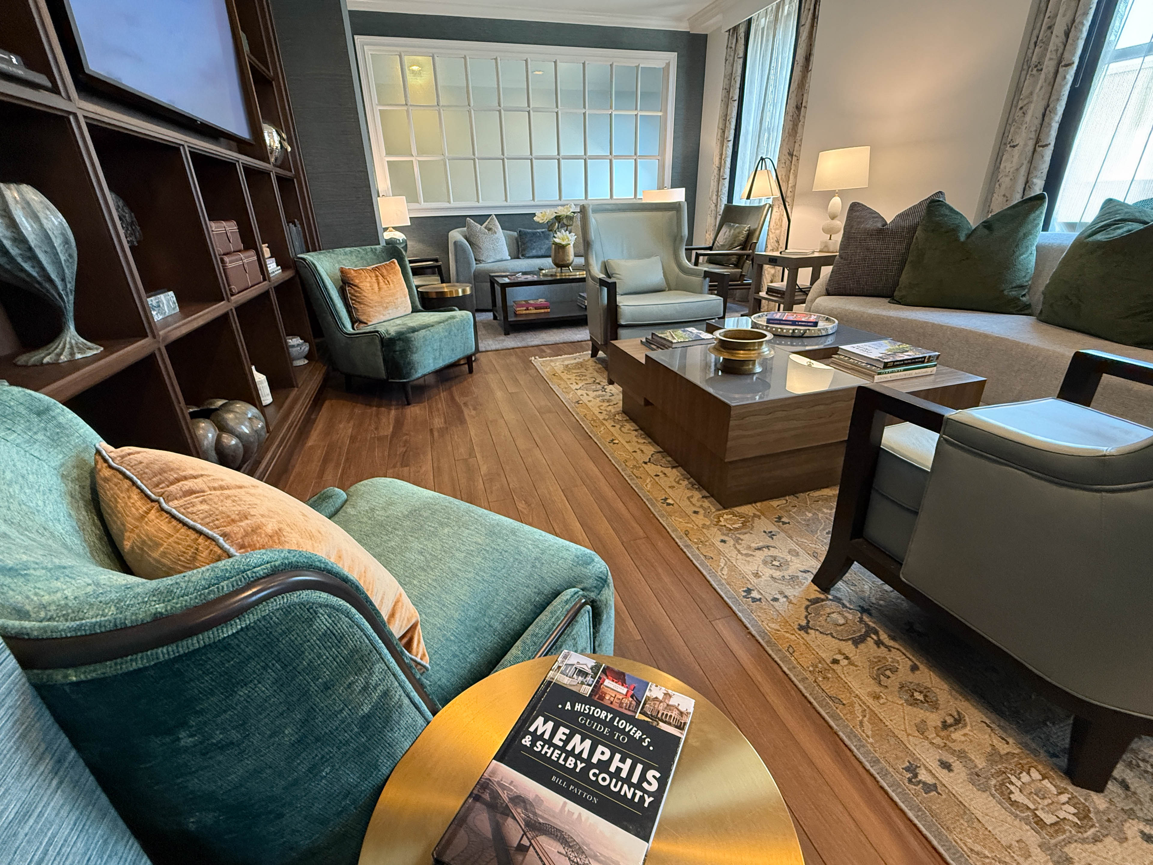 a living room with couches and a tv