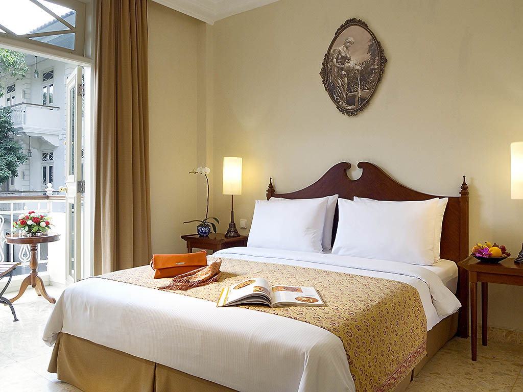 a bed with a book on it
