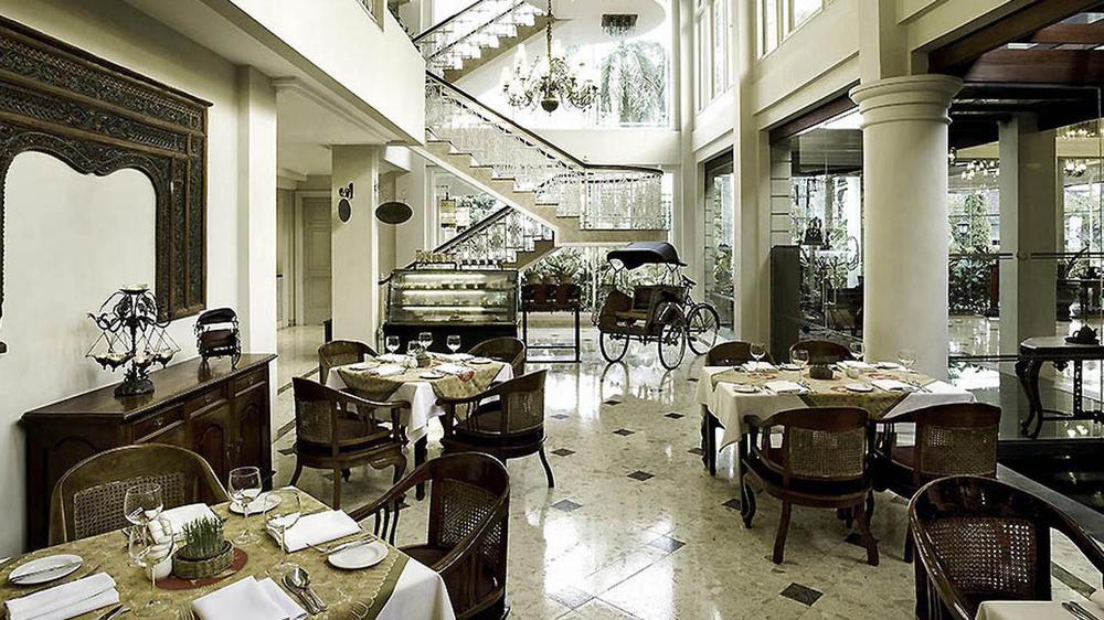 a restaurant with tables and chairs