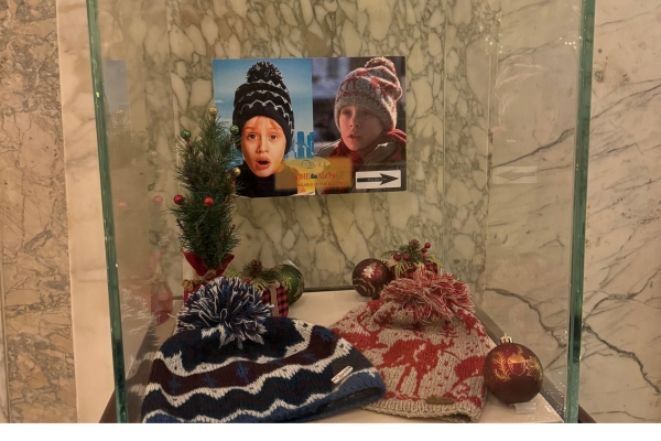 a display case with hats and ornaments