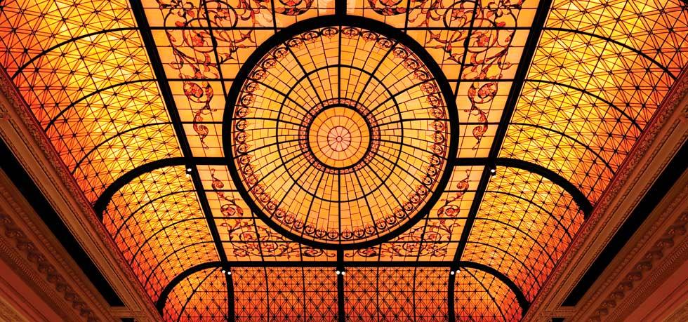 a stained glass ceiling with a circular design