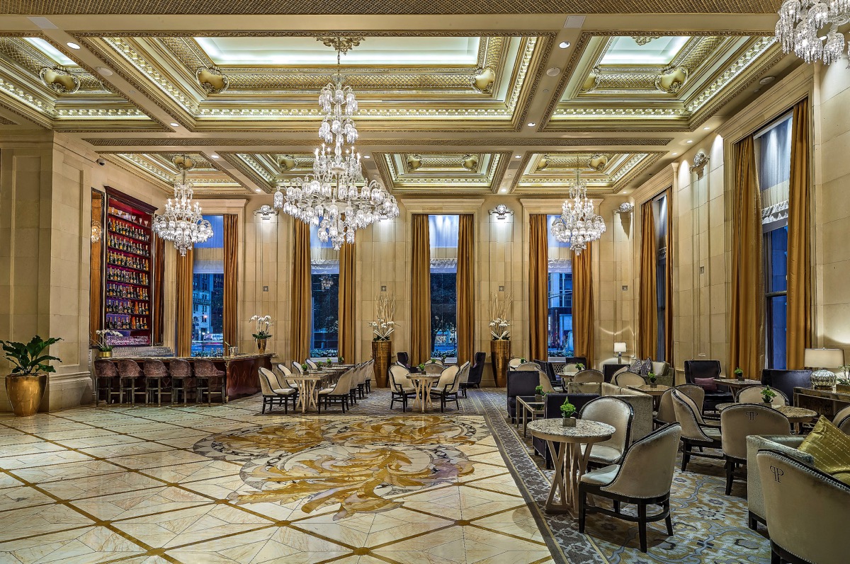 a room with chandeliers and tables