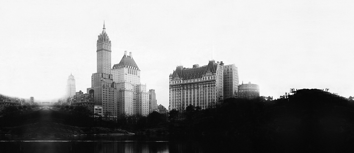 a group of buildings next to a body of water