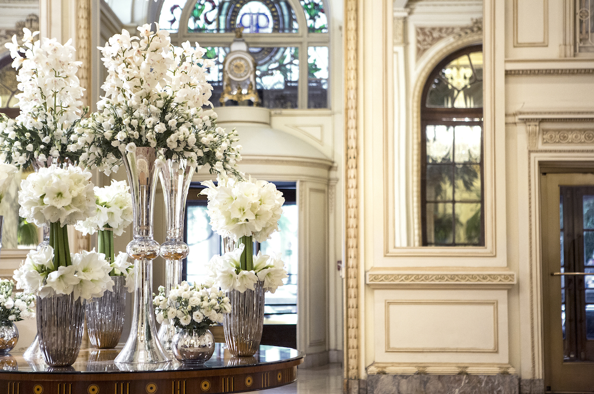 a group of vases of flowers on a table