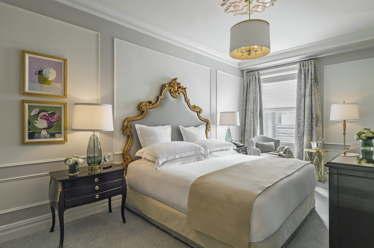 a bedroom with a bed and a lamp