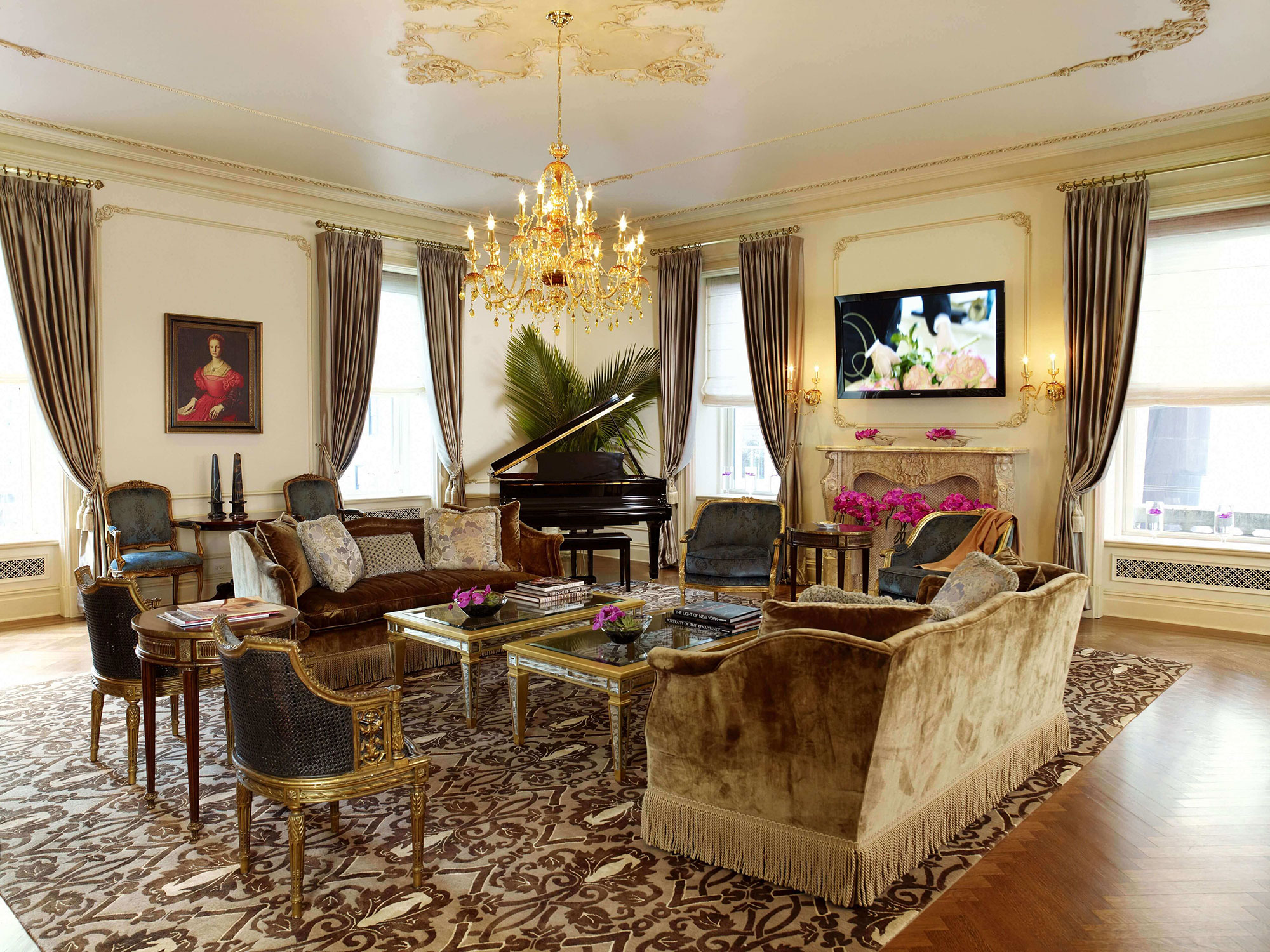 a living room with a piano and couches