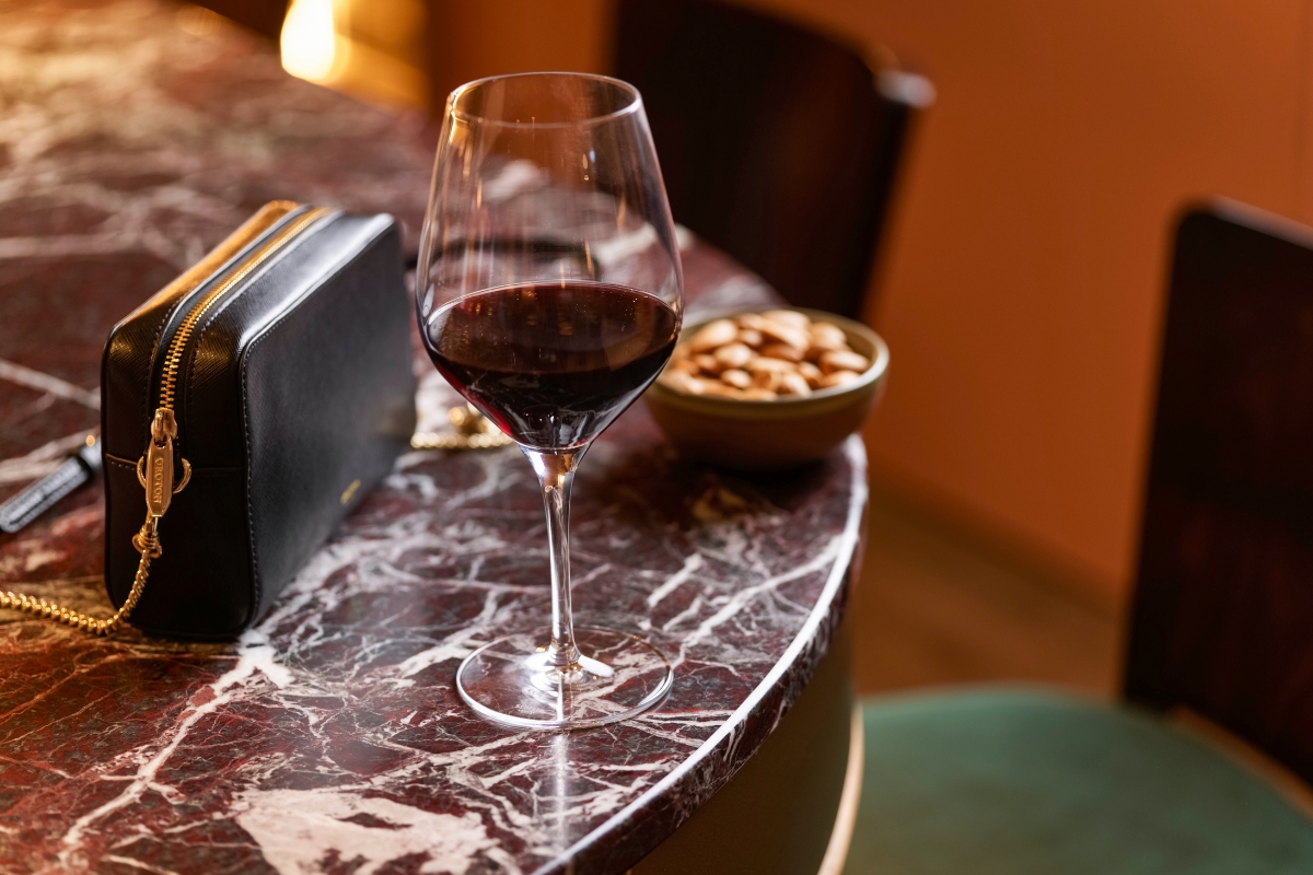 a glass of wine on a table