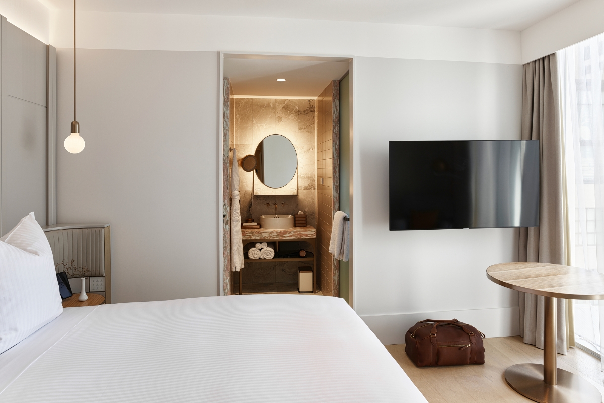 a room with a tv and a bed