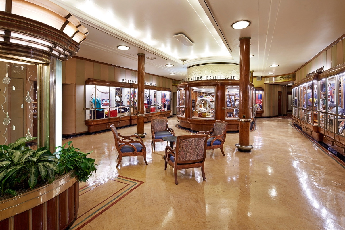 a room with chairs and a display case