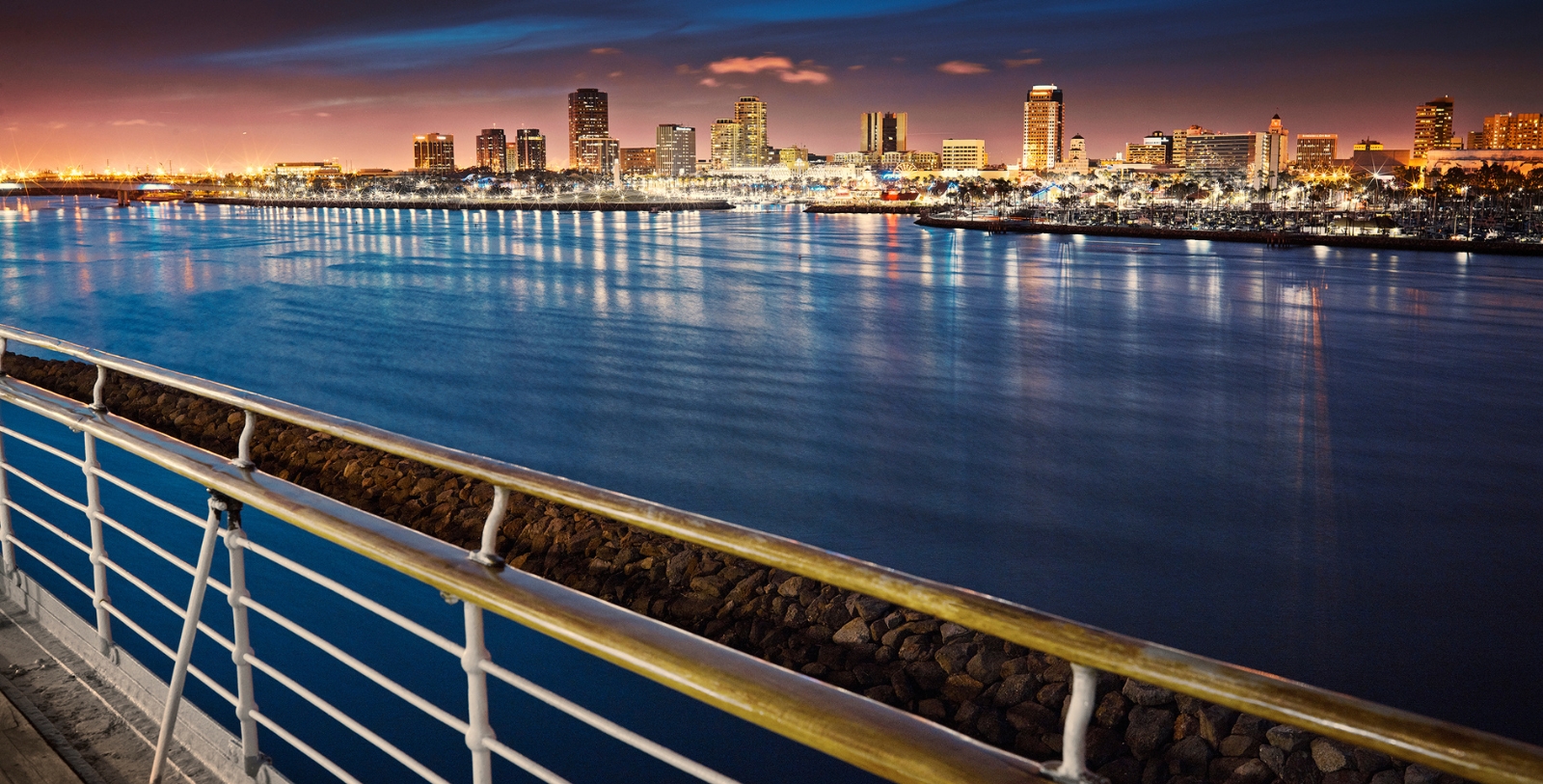 a city skyline with lights and water