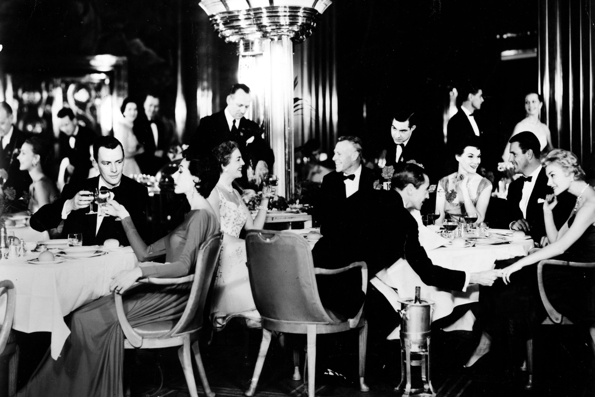 a group of people sitting at tables