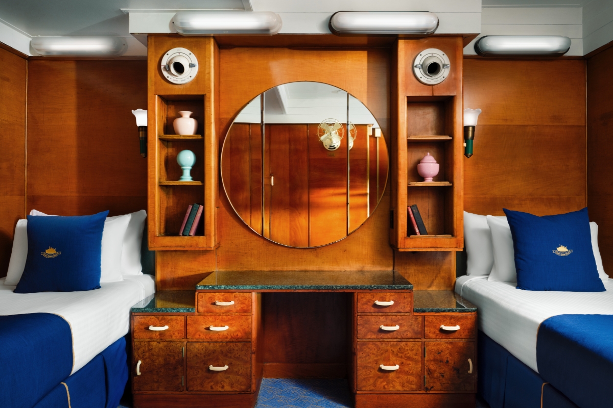 a mirror above a bed
