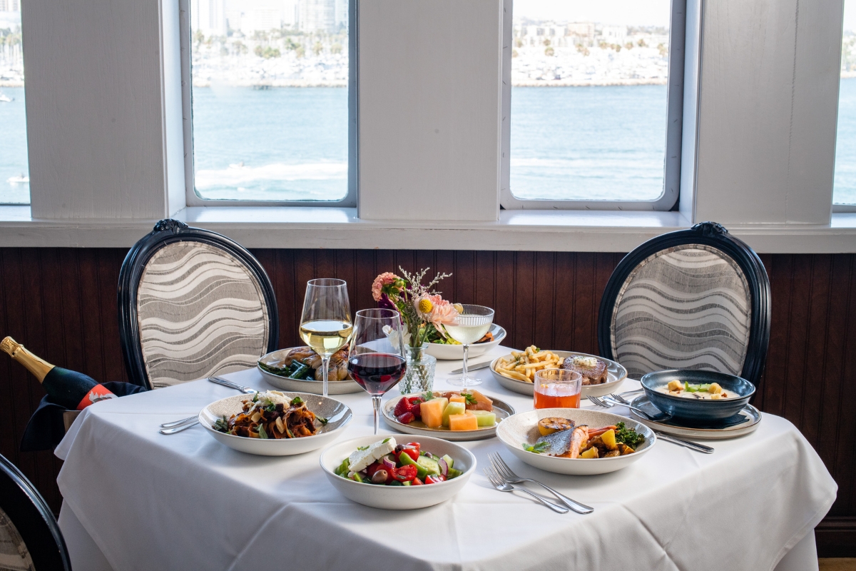 a table with food and wine glasses