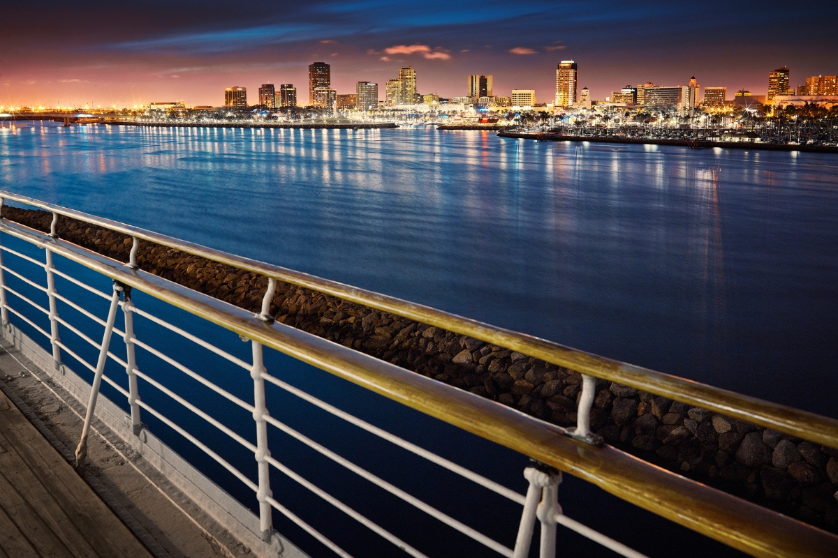 a city skyline and water at night