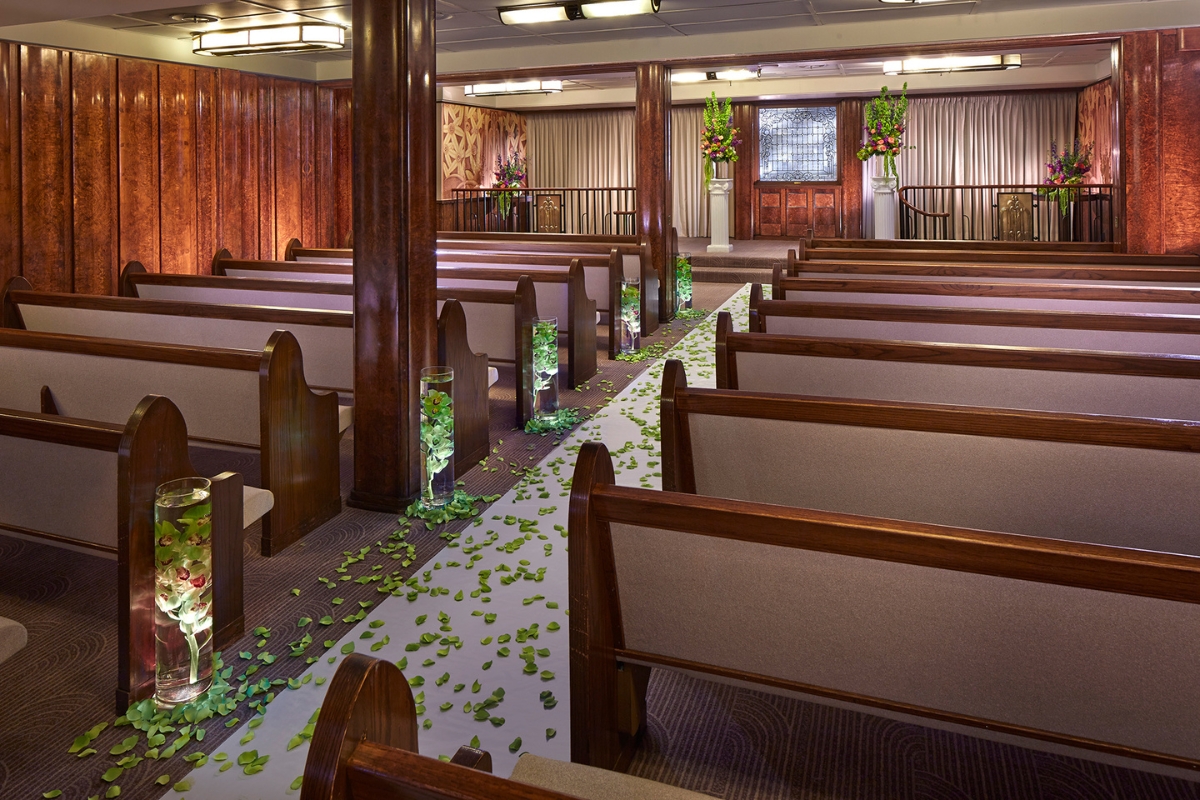 a church with pews and flowers