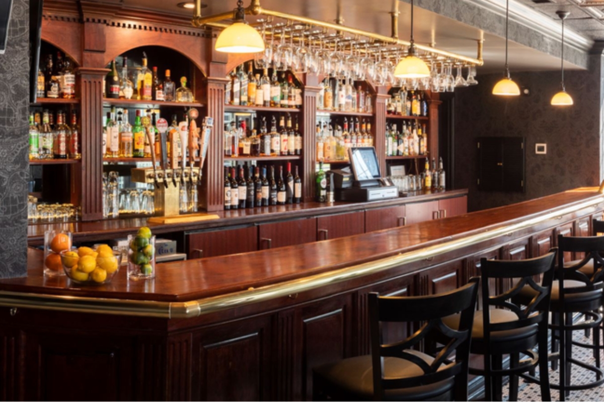a bar with many bottles of alcohol