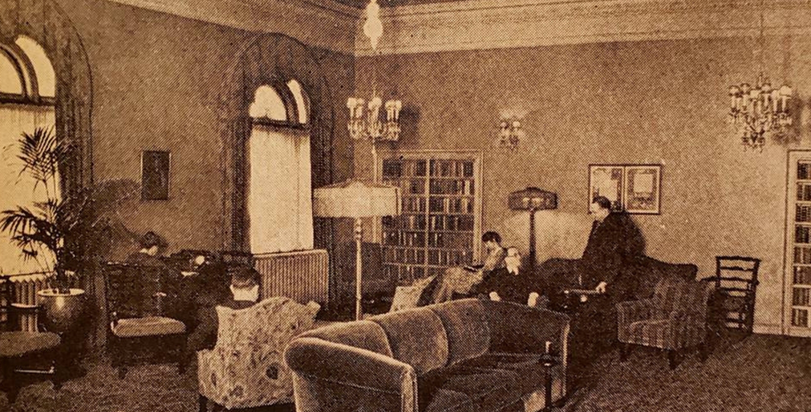 a group of people sitting in a living room
