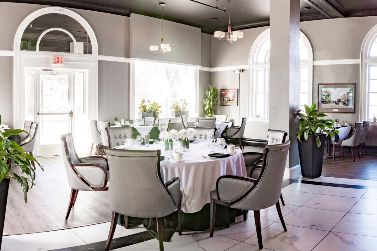 a room with a round table and chairs